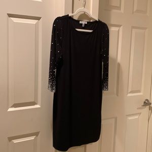 NWOT Never worn, beautiful black dress with pearl and silver accents on sleeve